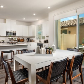 Wide open living areas perfect for entertaining dining room table with seating and large windows