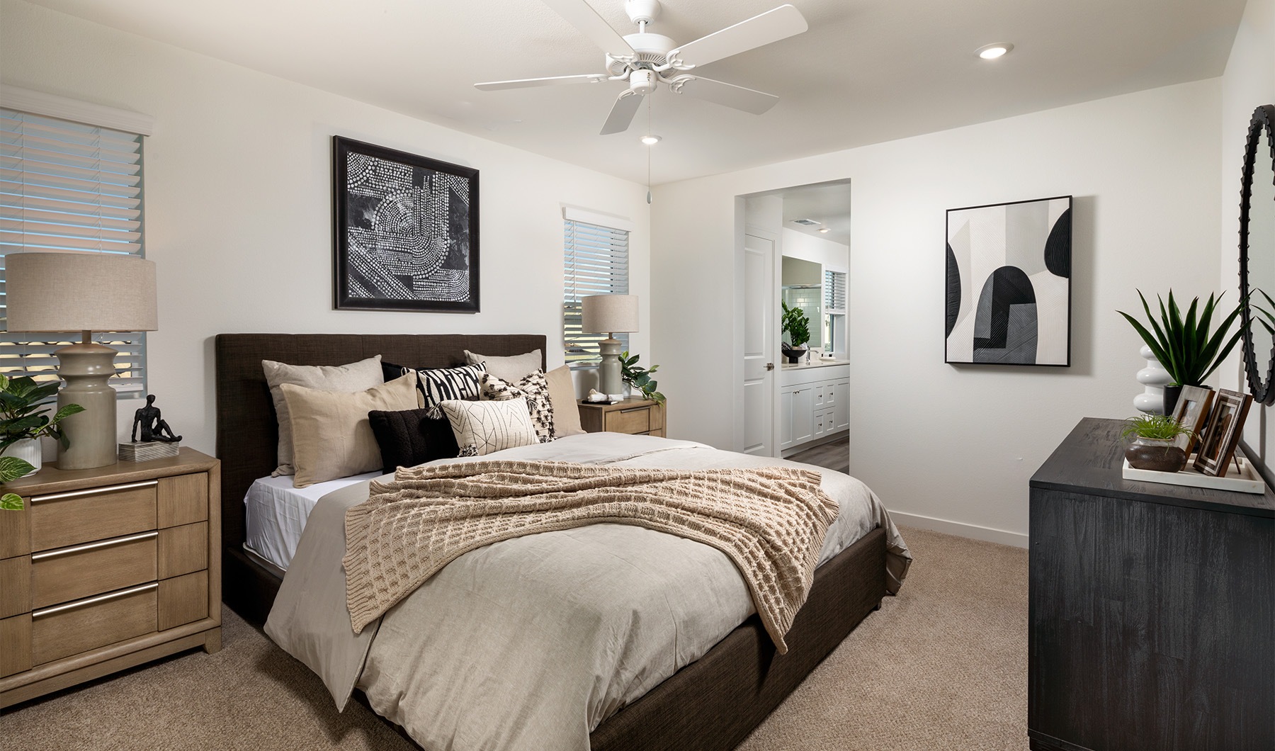 a bedroom with multiple windows