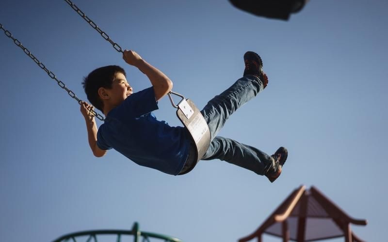 a boy on a swing