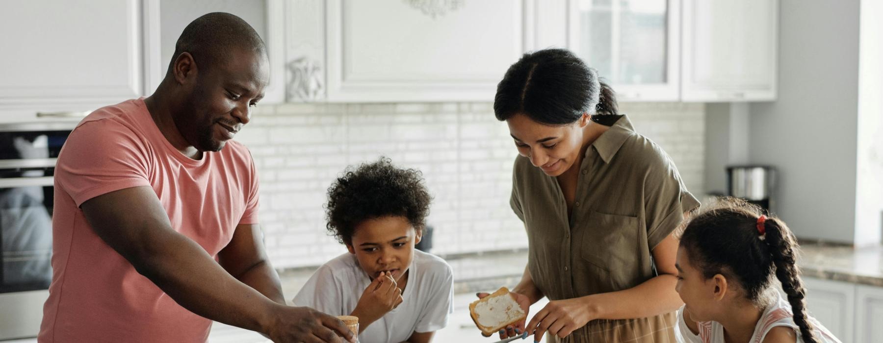 a family preparing food in the kitchen