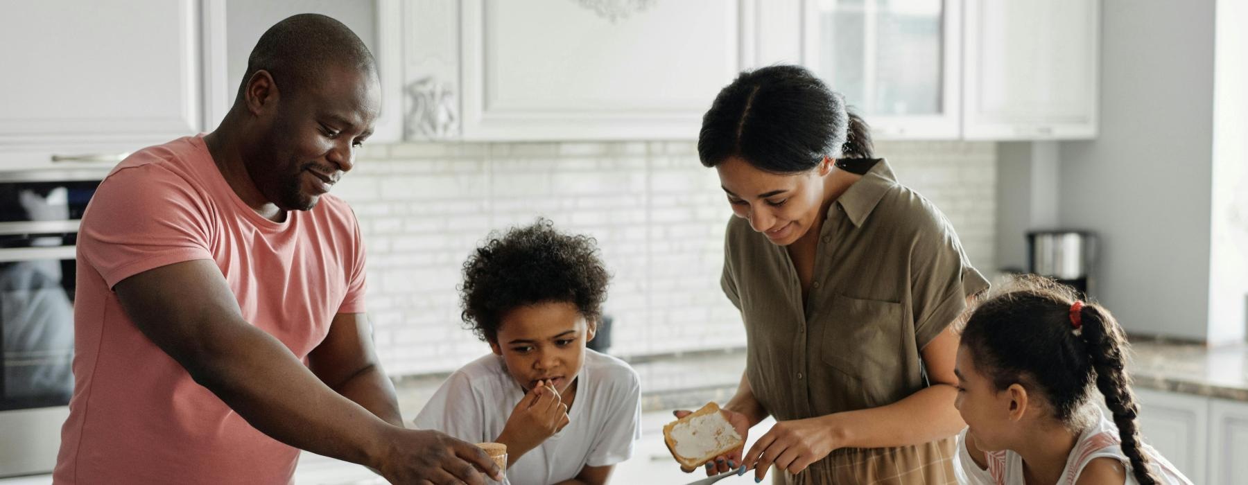 a family preparing food in the kitchen